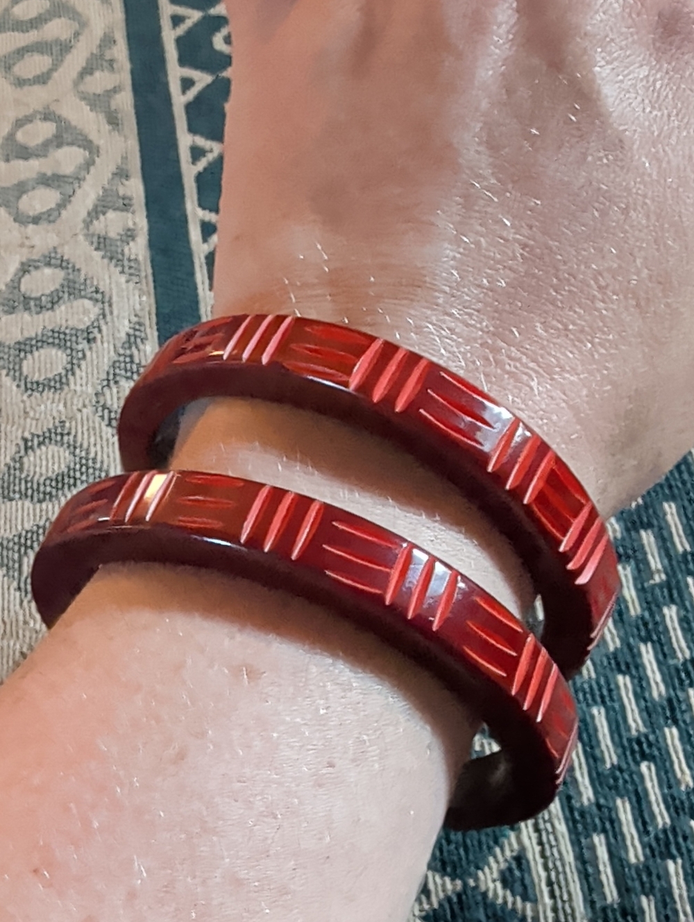 Bow And Crossbones Brown And Orangey-red Carved Bangle Bracelets - Set of 2